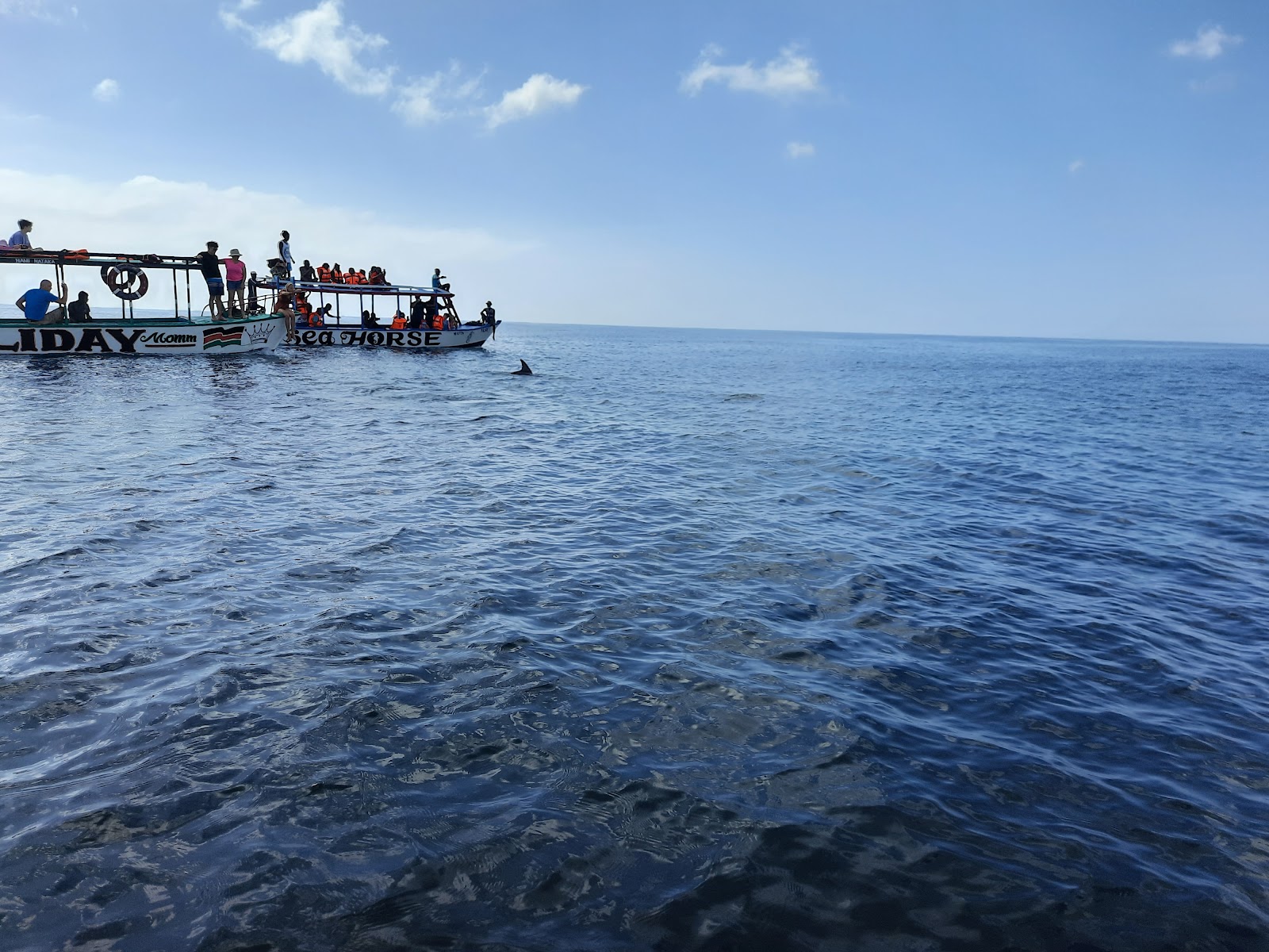 Canoes sailing through the water of Watamu close to sudi island
